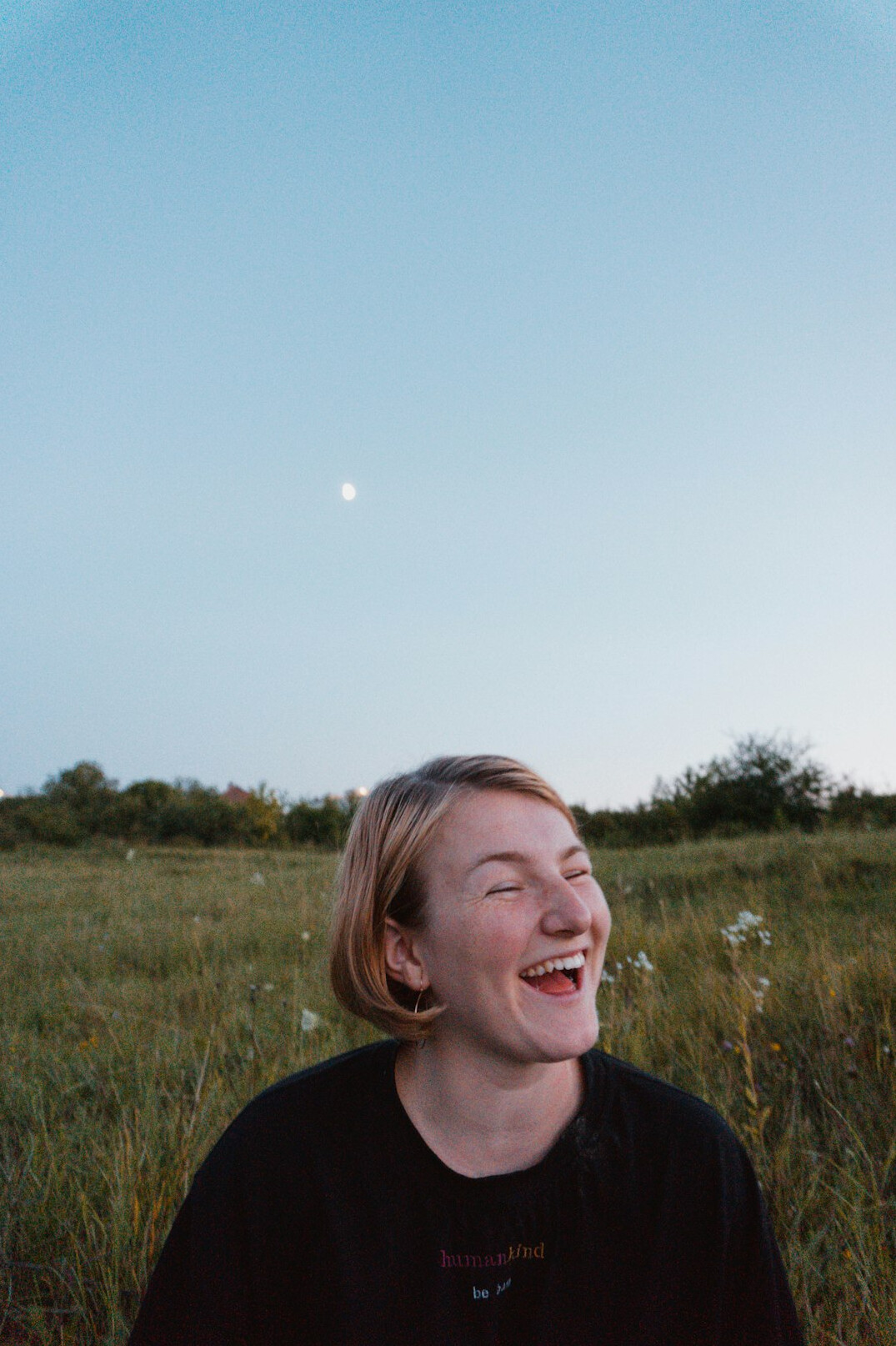 Portrait of a woman with light hair smiling